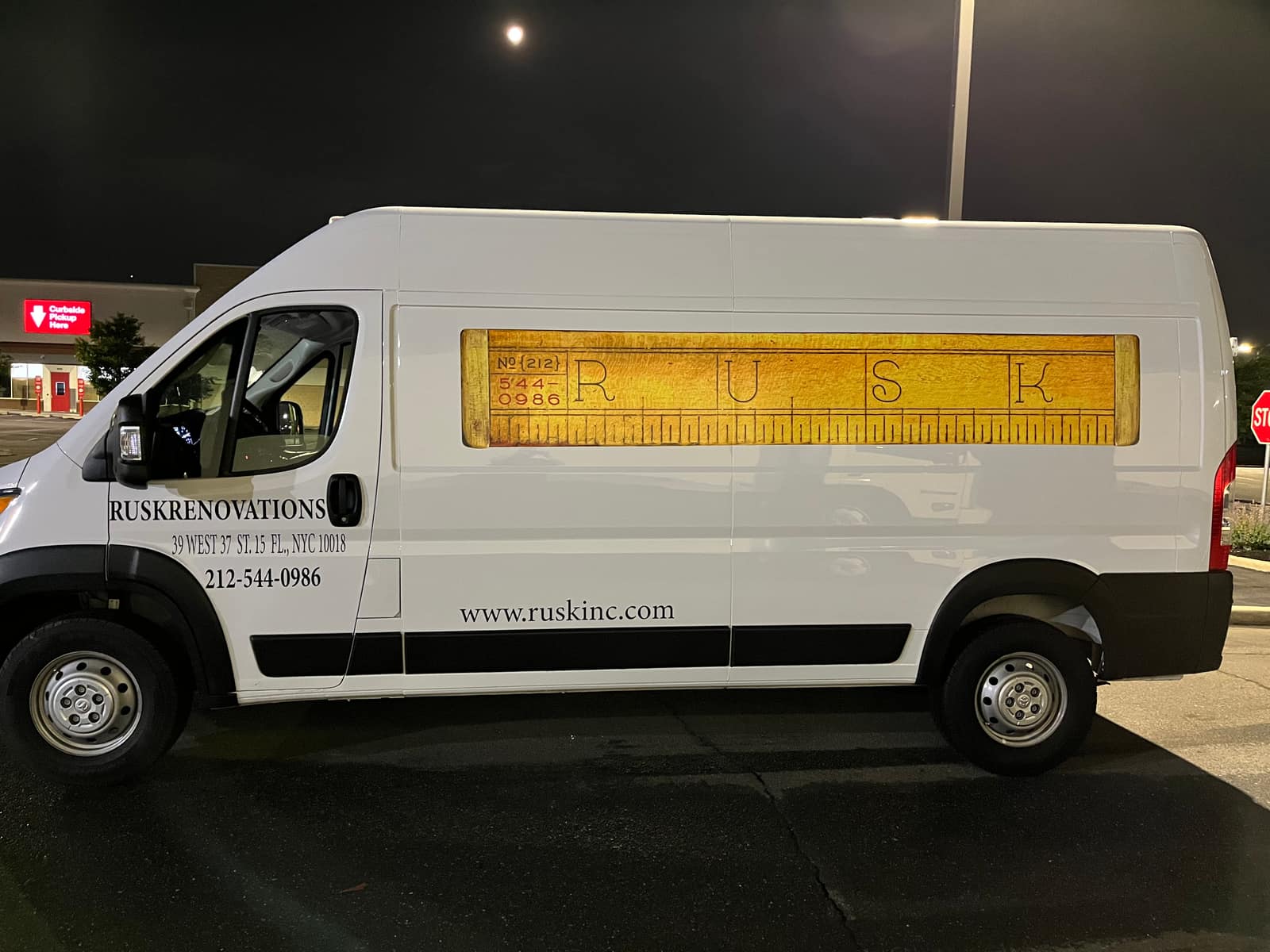 White Ram ProMaster with a printed side panel and cut vinyl lettering for Rusk Renovations